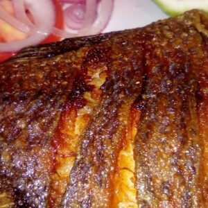 Wet fry fish served with Ugali and indigenous healthy veges